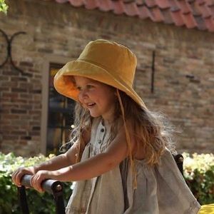 Kids linen bucket hat mustard yellow by French brand Atelier Des Femmes
